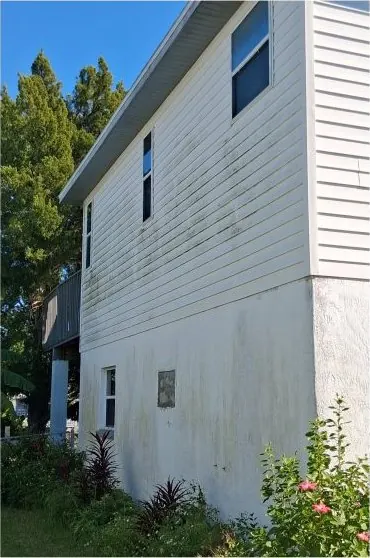 Before: two-story house soft wash by Waddle Works