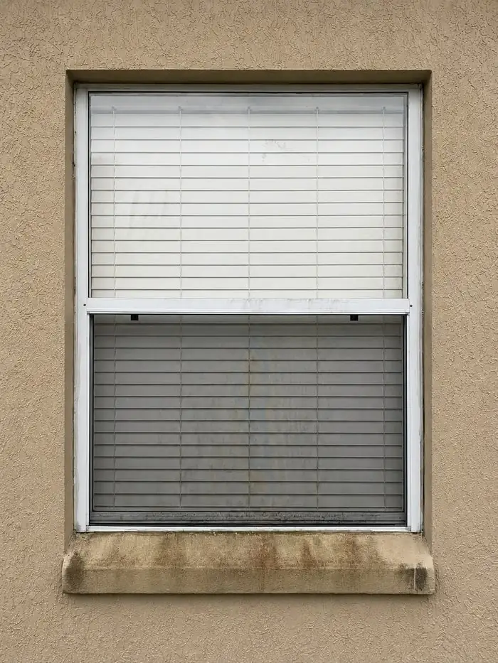 Before: window and stucco sill cleaning by Waddle Works